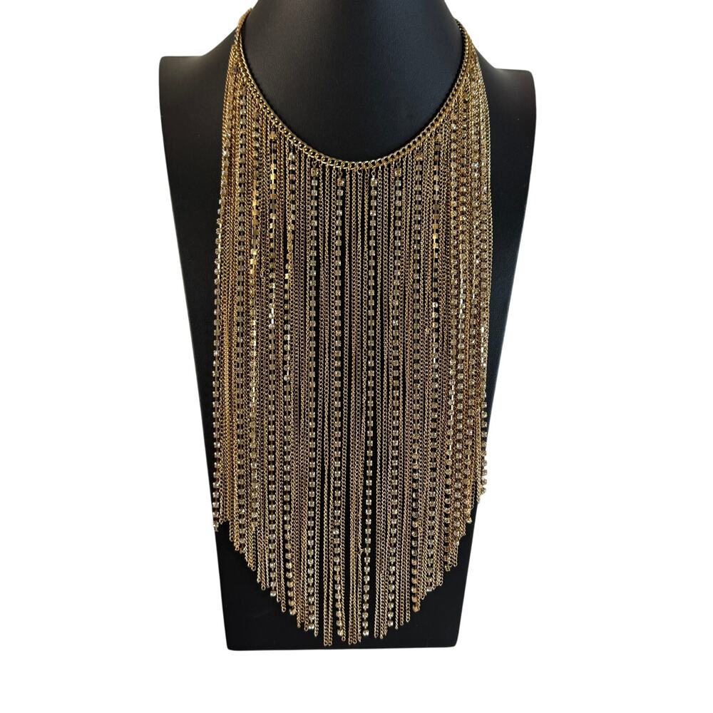 Gold-toned and rhinestone bib necklace. 19.75” length necklace.